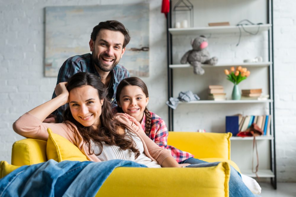 Happy Family Sitting Couch Living Room